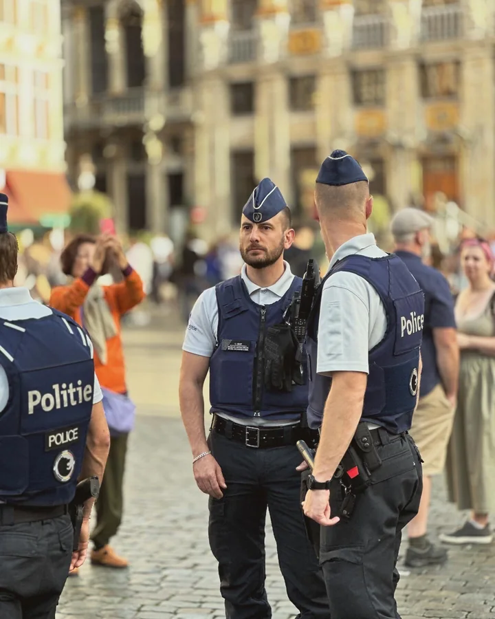Police officers standing in a busy city square